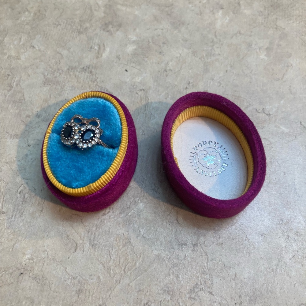 Poppy angel off double onyx ring